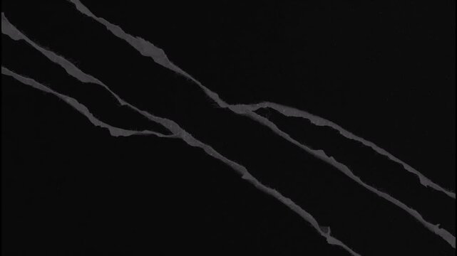 Animated black torn paper ripping transition effect