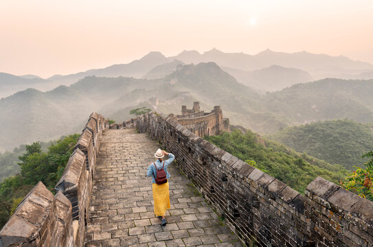 A young tourist is all alone at the Mutianyu Great Wall of China