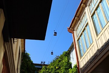 Transport, cable car cabin, funicular in Tbilisi above the houses in the old town