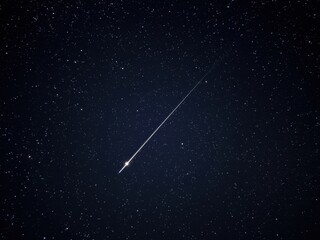 Shooting star in night sky