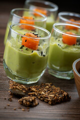 Smoked salmon shot glasses guacamole served with homemade crackers. High quality photo
