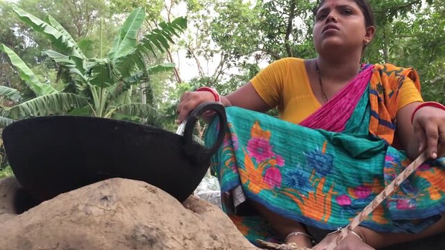 Rural Indian Woman Cooking Outdoors in Traditional Village Kitchen, Preparing Food on Wood Fire Chulha, Authentic Indian Lifestyle, Culture and Rural Life