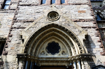 Historic Architecture: Gothic Stone Church Facade Showcasing Intricate Entrance Details Vertical