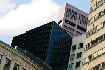 Urban Skyline: City High-Rises Reflecting Blue Sky Among Historic Buildings Vertical