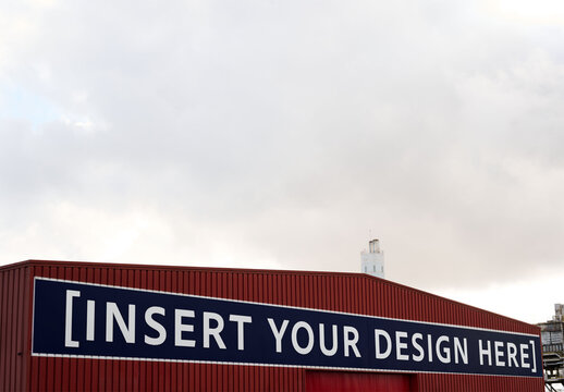 Bright Red Warehouse billboard With Clear Sky. PSD template mockup.