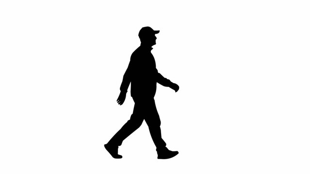 Silhouette of a man walking wearing a baseball cap.