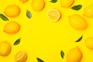 Lemon on a wooden table. Fresh lemon with a slice. Fresh lemon with citrus leaves. Lemon juice. Food and drink ingredients preparing. Healthy eating. Vitamin C. Space for text.