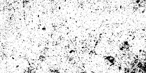 An abstract black and white texture exhibiting a thoroughly deteriorated surface covered in scattered grit and fine scratches.