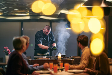 Family and friends gather for iftar meal during Ramadan with a chef preparing traditional food in a cozy restaurant setting