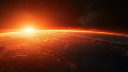 Obraz premium Sun rising over Earth viewed from space with red glow and atmospheric perspective creating epic scene.