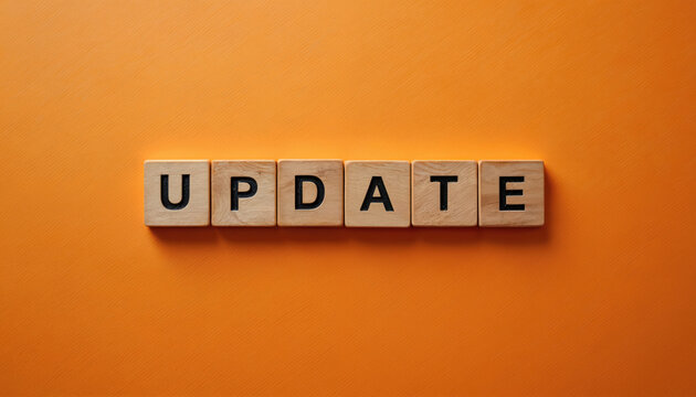 Wooden letter blocks spell out UPDATE on bright orange background. Simple graphic for change, news, refresh, or progress messages. Concept for modern life improvements.