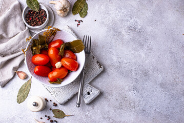 Marinated pickled tomatoes in jar