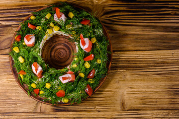 Festive salad in shape of the Christmas wreath. Christmas and new year celebration. Top view
