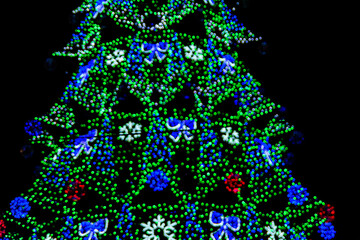 Background of the blurred colorful christmas lights. Bokeh pattern