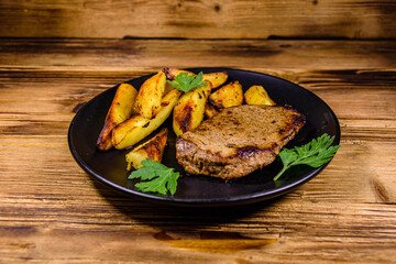 Roasted beefsteak with the fried potato and parsley