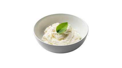Ricotta cheese in a white bowl with basil leaf