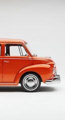 Classic orange vehicle against a plain white background studio style