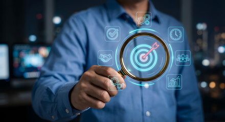 Businessman analyzing data with magnifying glass and digital icons