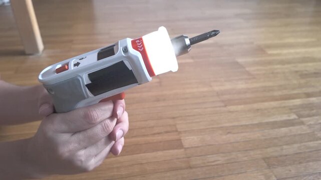 Right side cordless electric screwdriver tested in mid air