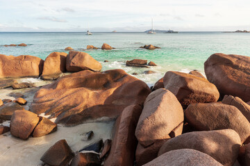 Anse Lazio beach, Praslin island, Seychelles. Sunny rocky shoreline