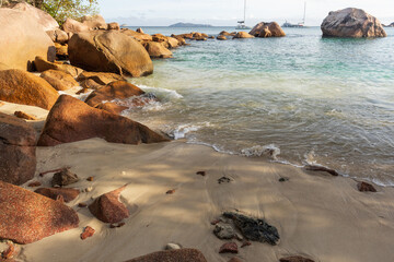 Anse Lazio beach, Praslin island, Seychelles. A rocky shoreline frames a sunny beach