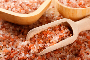 Close-up of Himalayan salt crystals in a wooden spoon