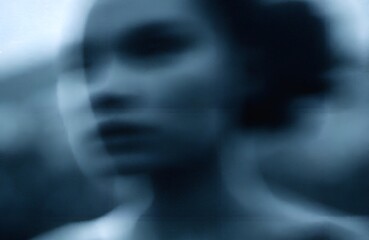 Abstract Blurred Female Portrait with Emotional and Dreamy Mood