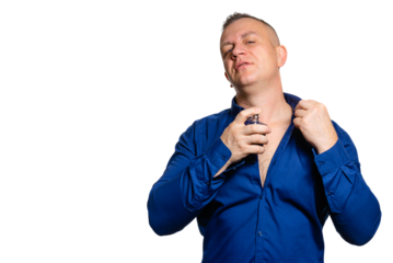A confident man applies cologne to his body. on transparent background.