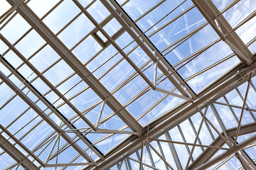 Building glass roof and blue sky on background