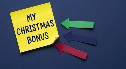 Yellow note displays "My Christmas Bonus" with blue writing. Three colored paper arrows represent financial direction, growth, or company success
