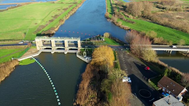 Aerial drone view of Denver sluice in Eastern England. River system water management and flood alleviation protection barrier. Sunny winter Day,