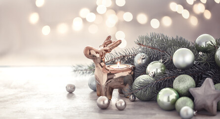 Christmas holiday background with candle holder, Christmas tree and Christmas tree toys.