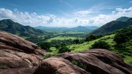 Stunning mountain landscape with lush green valley, expansive sky, dramatic clouds, and rugged terrain perfect for outdoor adventure and scenic travel