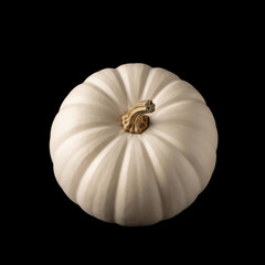 Isolated pale pumpkin with vertical ridges on a black background, representing autumn, harvest, and seasonal decoration, perfect for holidays