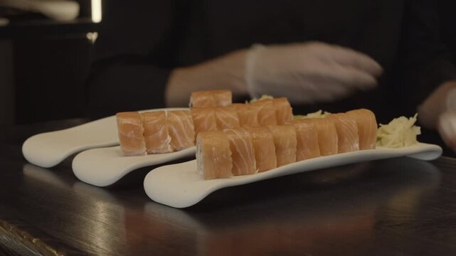 Chef Arranges Sushi, Culinary Expert Meticulously Arranges Salmon Pieces With Precision And Style . Media
