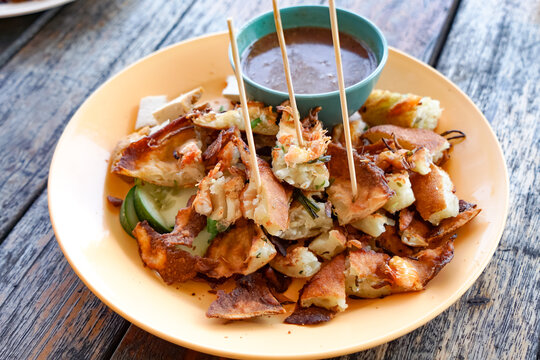 Crispy Cucur Udang with Dipping Sauce and Fresh Cucumbers