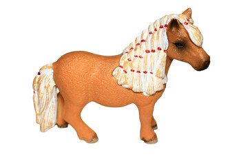 A small toy horse with a flowing white mane and bright red beads, perfect for imaginative play or decorative purposes © Fotograf