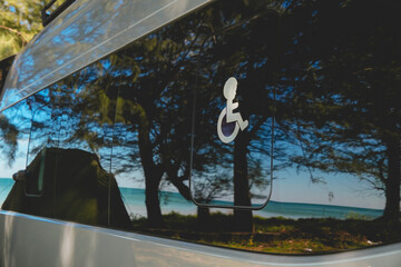 Accessible passenger van designed for wheelchair users, supporting inclusive transportation, mobility-friendly travel, and barrier-free transport services in an outdoor coastal environment.