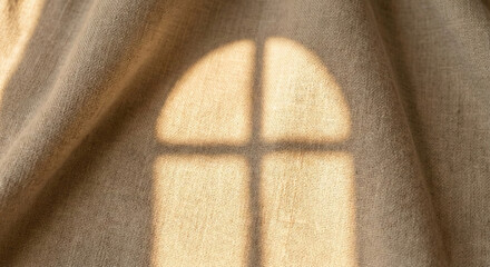 Beige linen fabric background with arched window shadow