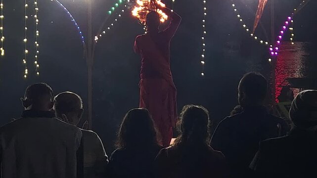 Spiritual evening aarti on the Narmada River in Jabalpur, showcasing Hindu devotion, diya lamps, riverfront rituals, and unrecognized people participating in worship.