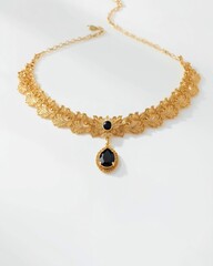 Elegant gold necklace with black gemstone