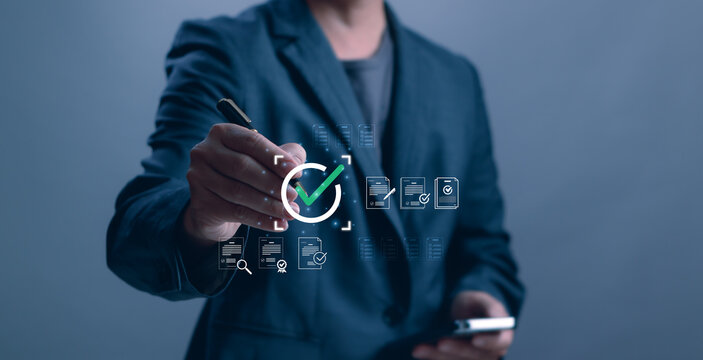 Businessman signing digital approval with virtual checklist and verified documents icons. Concept of compliance, validation, quality control, audit process and secure workflow management technology