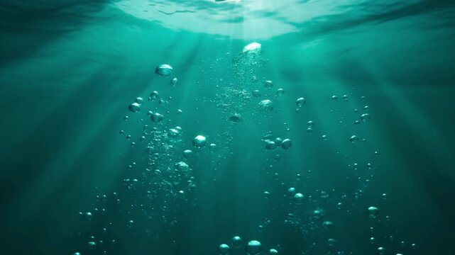 Sunlight filtering through the ocean's surface, illuminating the underwater scene with vibrant teal hues and suspended particles.