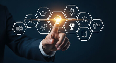 A businessman's hand touches a glowing lightbulb in a hexagonal grid interface.