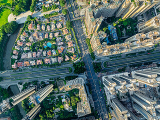 Top-down aerial view of the city streets and residential buildings.