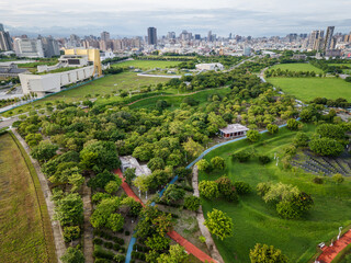 Aerial view of the vast green landscape of Taichung Central Park, a sustainable urban forest on a former airport. Taichung, Taiwan.
