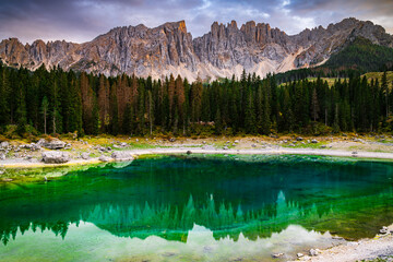 Lake Karer See or Lago di Carezza in Italian Alps Dolomites a UNESCO world heritage site in autumn...
