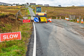 Rural roadworks with diversion signs on countryside road Scotland