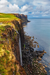Kilt Rock waterfall cascading over coastal cliffs Isle of Skye Scotland