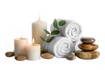 White towels candles and stones for relaxation on black isolated on a transparent background